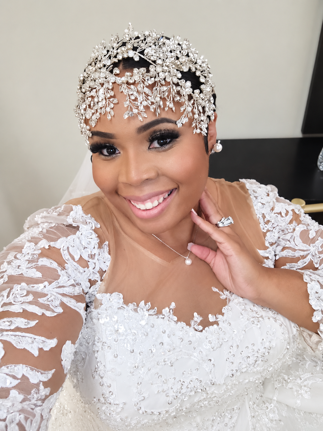Miss Tika bridal makeup with a jeweled silver headpiece