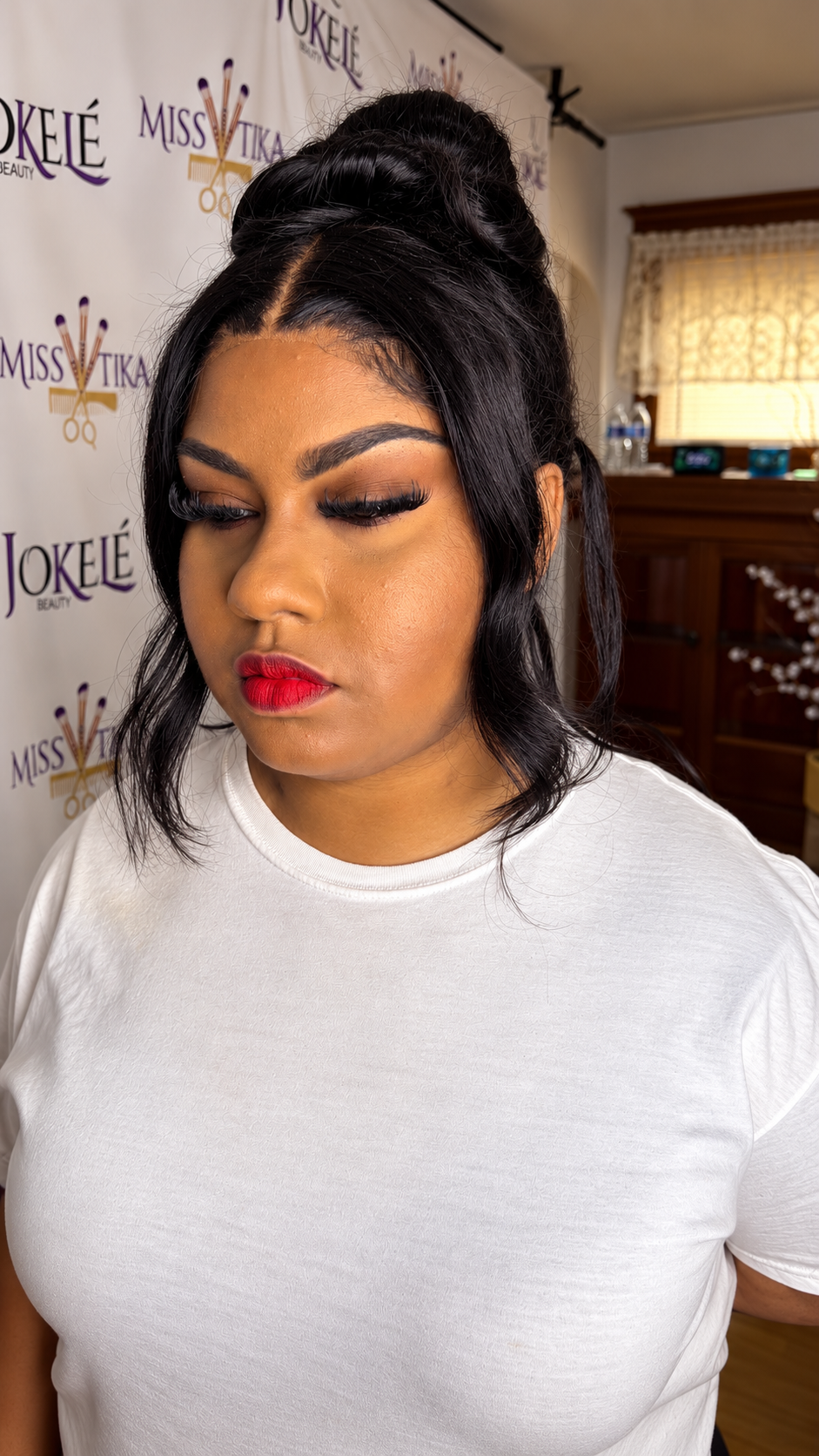 Lashes & a red lip — makeup by Miss Tika