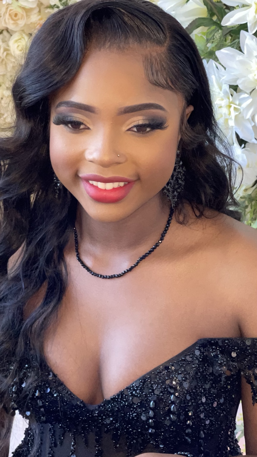 Miss Tika client with smoky eyes, full lashes, and a pink lip